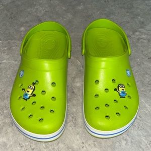 Green crocs with minion jibits